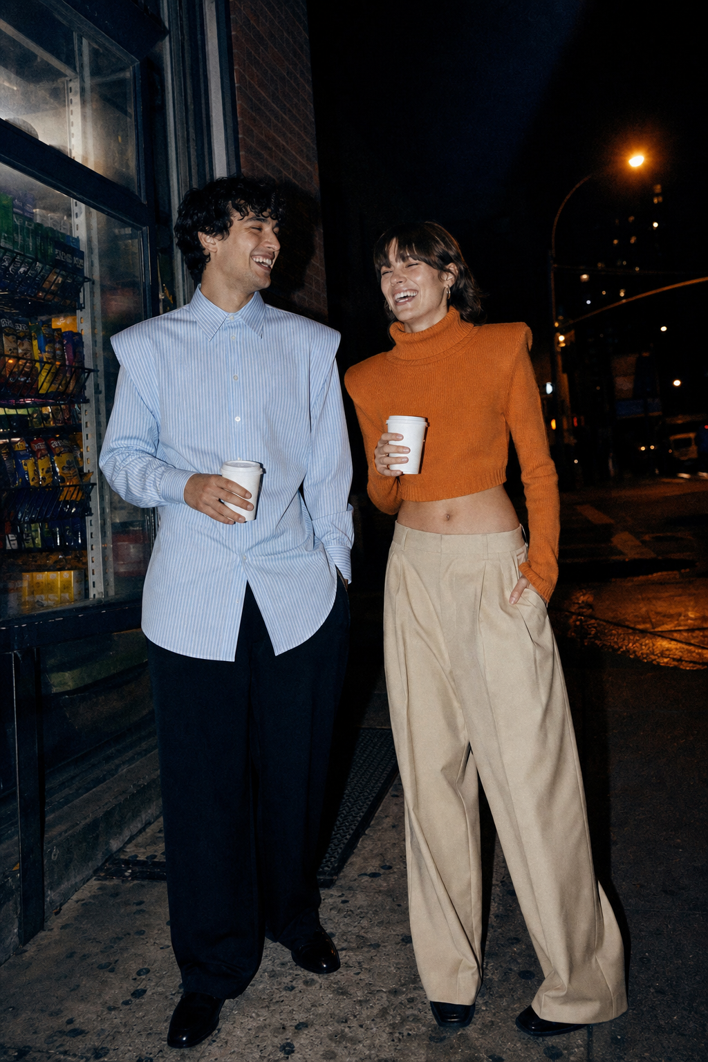 Two friends outside a bodega at 1 a.m. in the Bedford and the rollneck